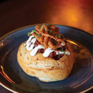 Hudsons Pub Beer Bacon Brat Chili Served in a Bread Bowl