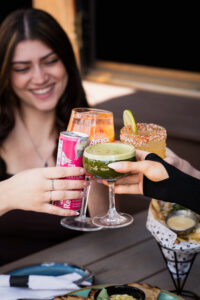 Hudson's Summer Discovery Menu 2026 — Hawktop orange wheat ale, Matcha Bloom, Mango Crush Sled Dog, Strawberry Peach Spritz, and Torched Mango Non-Alc-Arita