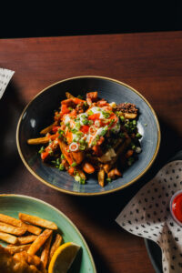 national poutine day at Hudsons Pub. Poutine shown is the Camp fire poutine. On April 11, half of Hudsons poutine profits will be donated to a local food bank 